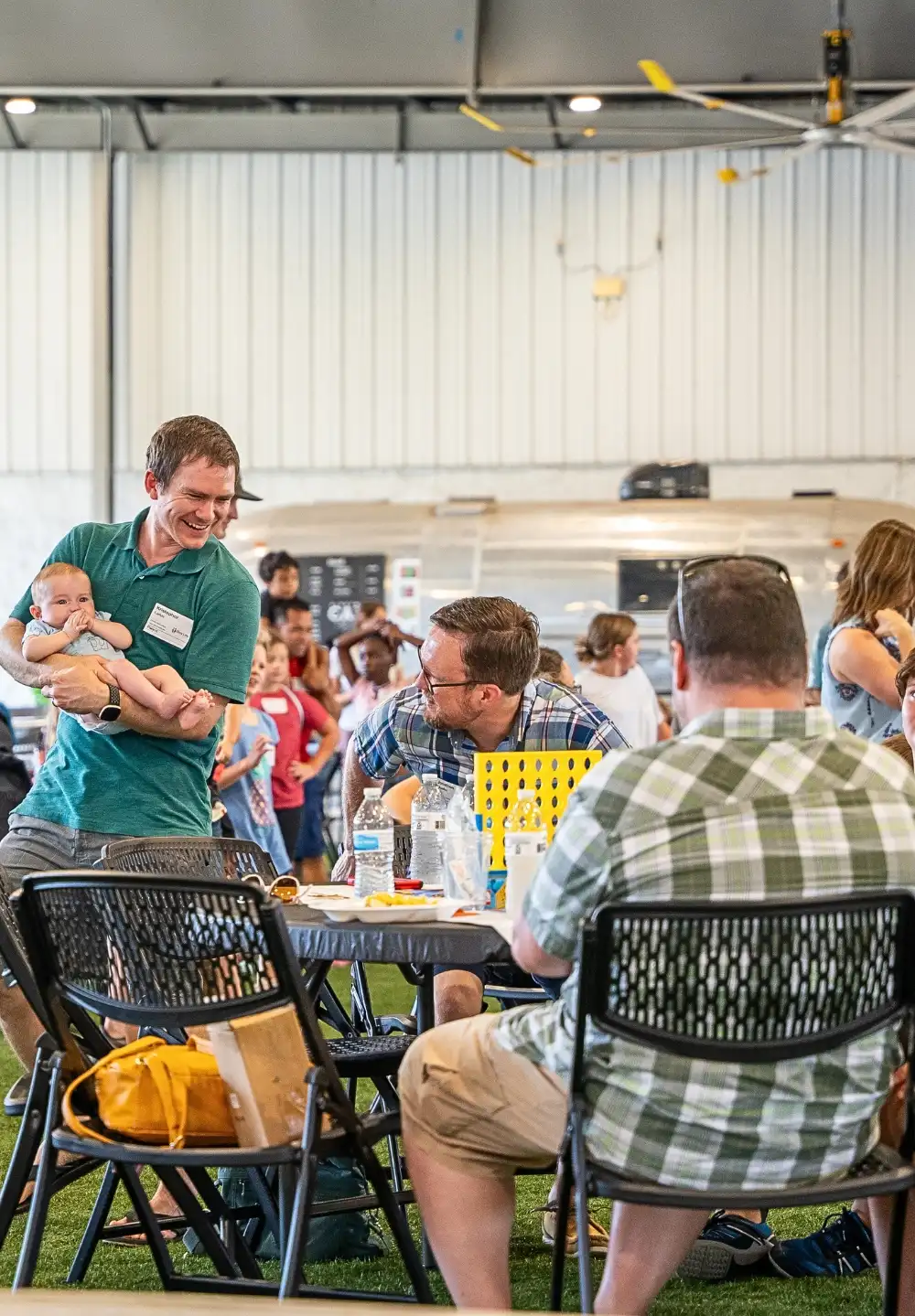 People speaking at a social event